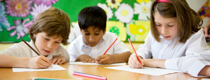 Students work with together to learn how to write their numbers.
