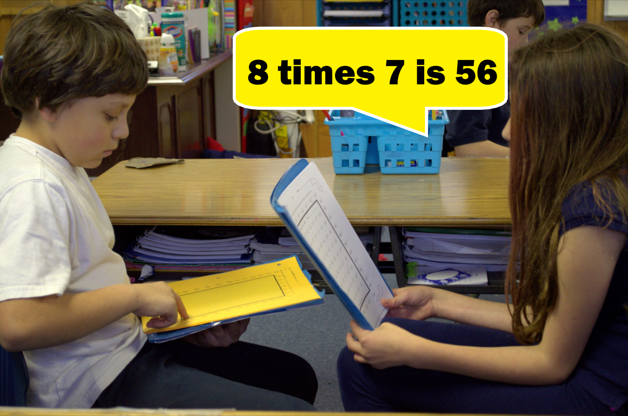 Two students participating in one of Rocket Math's math fluency programs