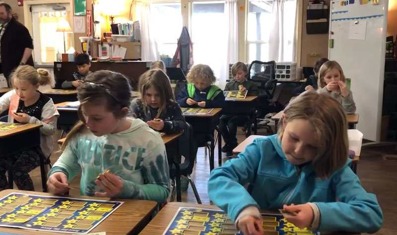 Students in classroom playing Rocket Math's Race for the Stars math fact game